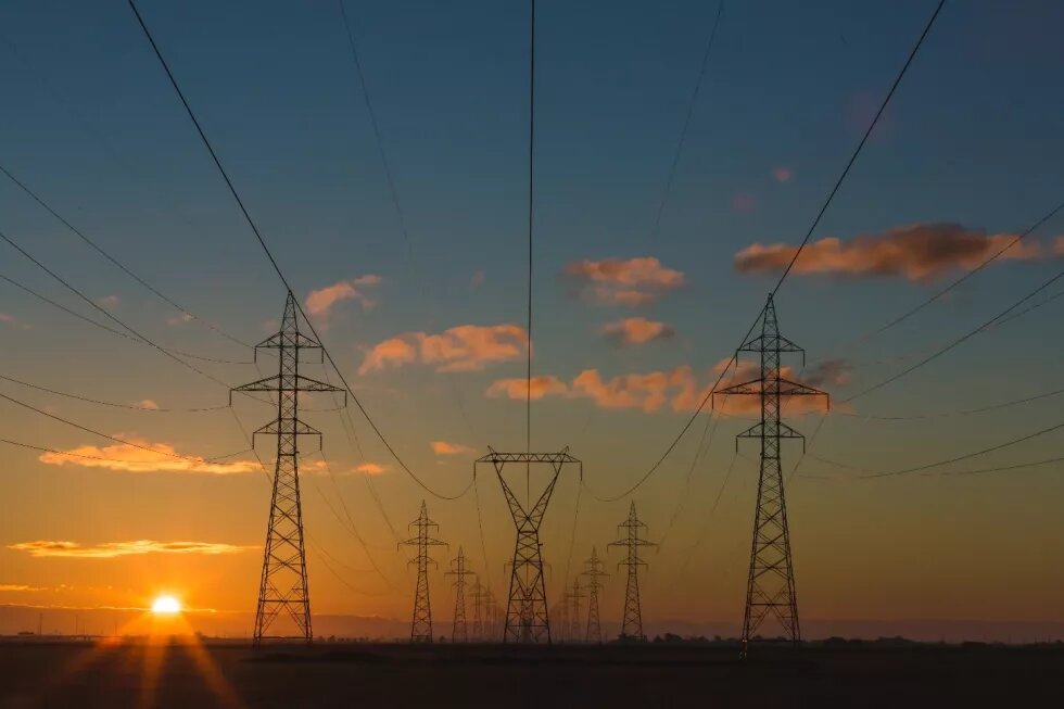 Power pylons at sunset