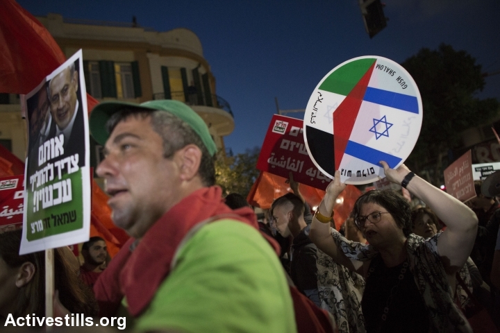 Jewish and Arab protesters march during a demonstration against the occupation, calling the Israeli government to resign, in central Tel Aviv, May 28, 2016